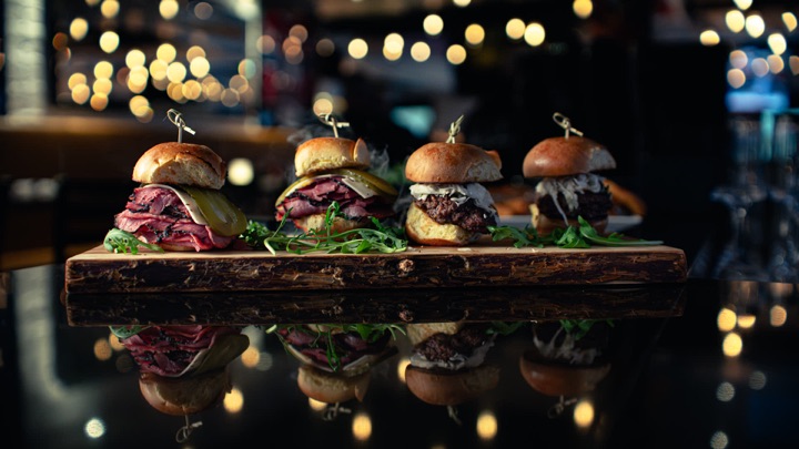 Sliders on a wooden board with bokeh lights behind