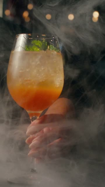 Cocktail served in a cloud of smoke