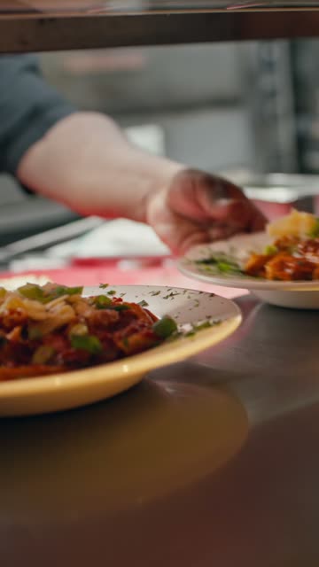 A plate set down at the kitchen pass